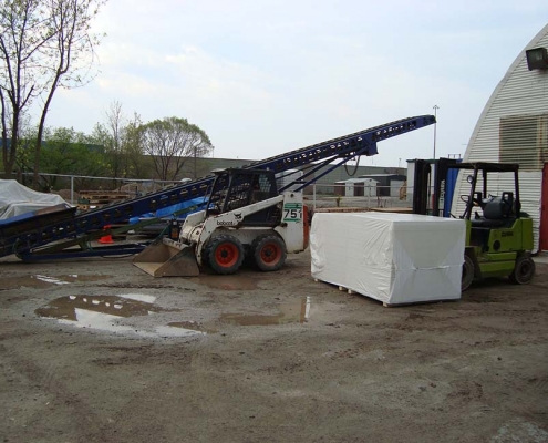 conveyor bobcat forklift in sproule yard